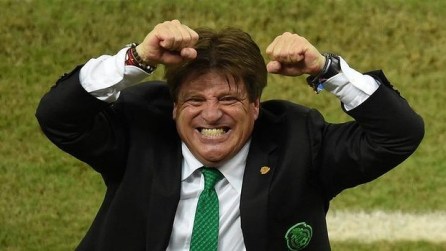 Mexico's coach Miguel Herrera celebrates after the victory over Croatia in Group A